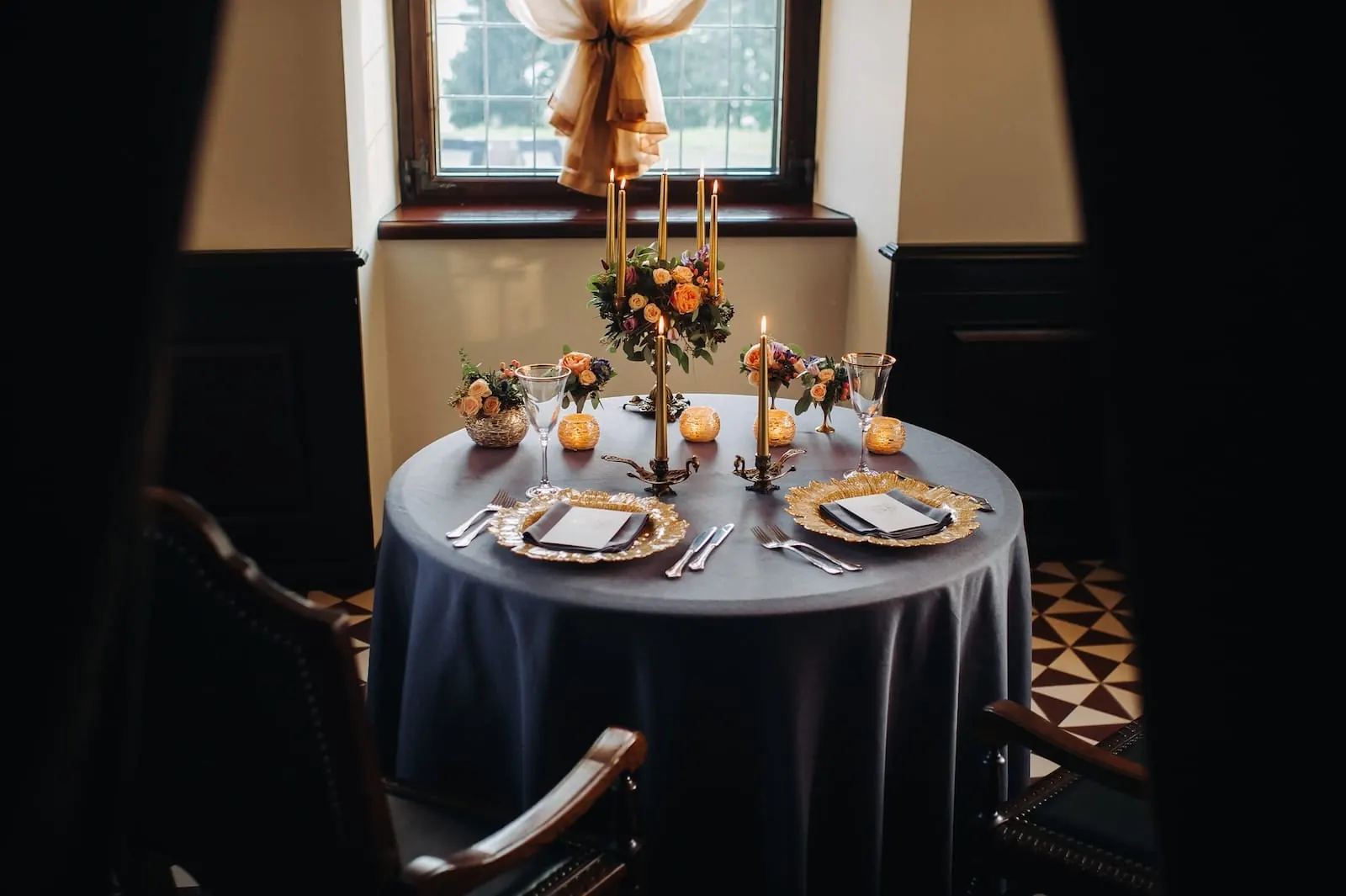 Table decorated with flowers and candles